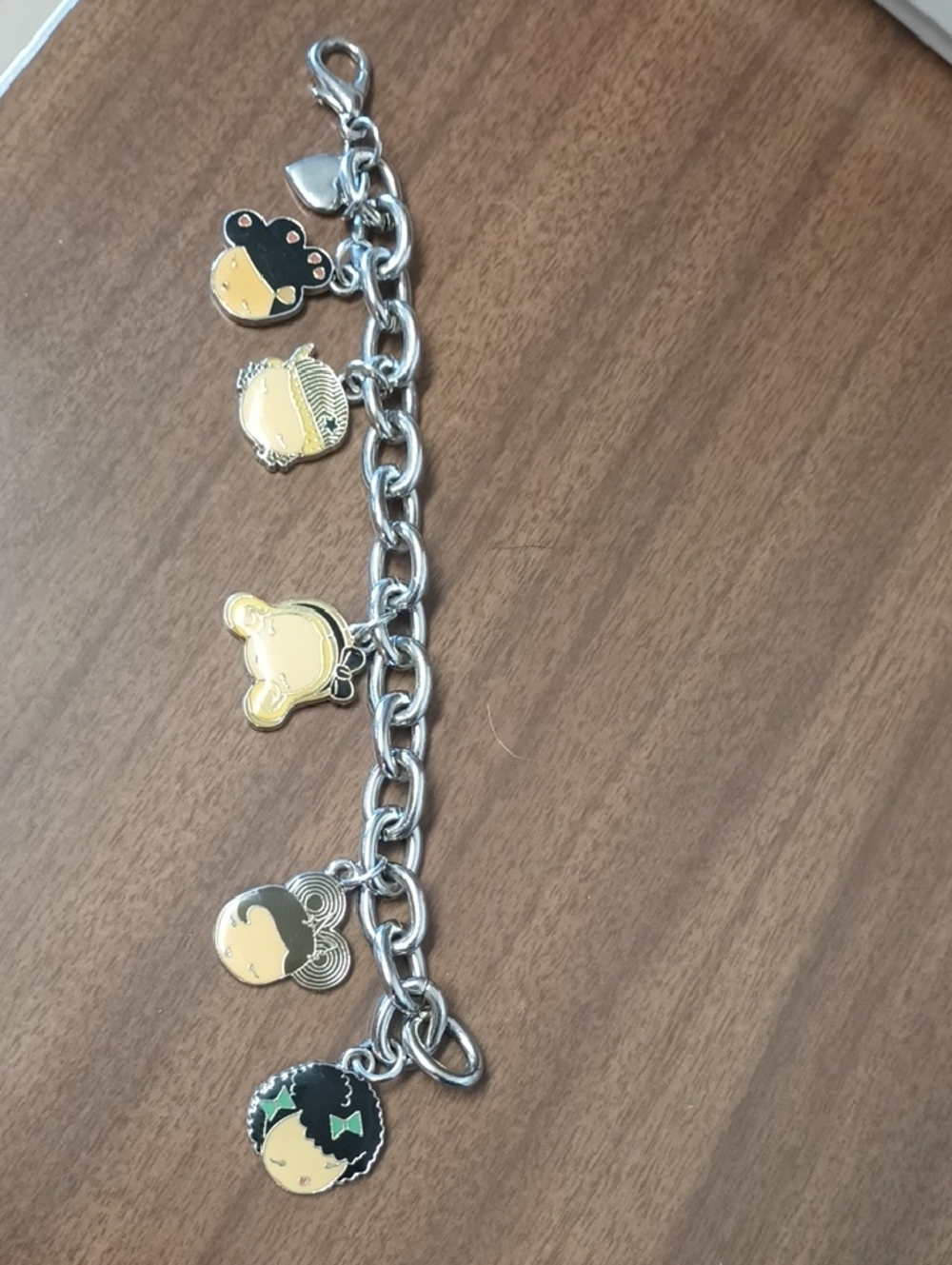 Silver Charm Bracelet with Yellow and Black Enamel Faces